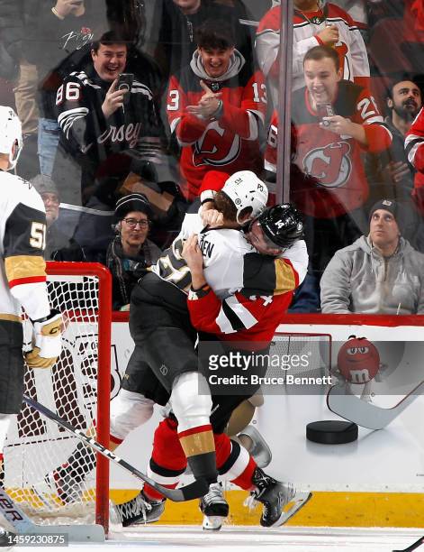 Nathan Bastian of the New Jersey Devils and Brett Howden of the Vegas Golden Knights fight during the second period at the Prudential Center on...