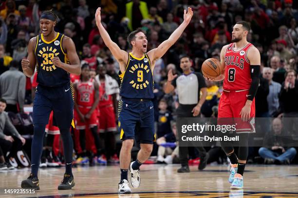 Myles Turner and T.J. McConnell of the Indiana Pacers celebrate in the fourth quarter of the game against the Chicago Bulls at Gainbridge Fieldhouse...