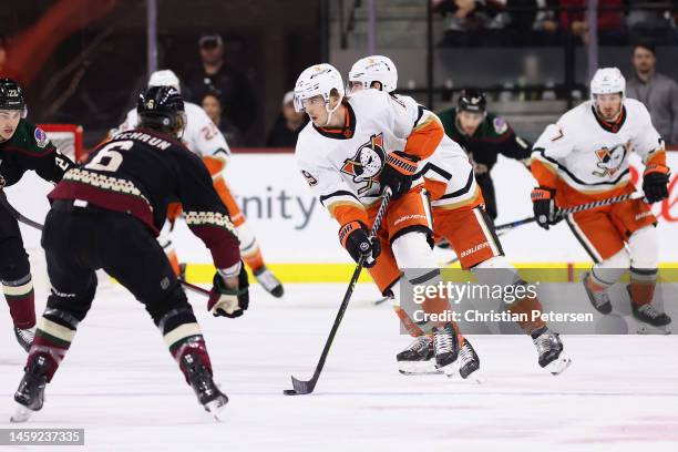 Troy Terry of the Anaheim Ducks skates with the puck against Jakob Chychrun of the Arizona Coyotes during the first period of the NHL game at Mullett...