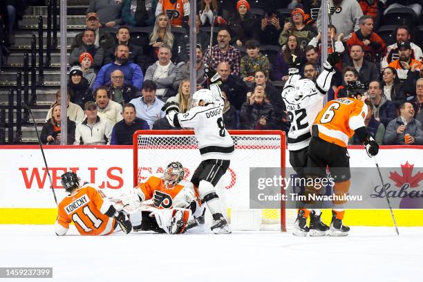 Drew Doughty and Kevin Fiala of the Los Angeles Kings celebrate a goal scored by Fiala during overtime against the Philadelphia Flyers at Wells Fargo...