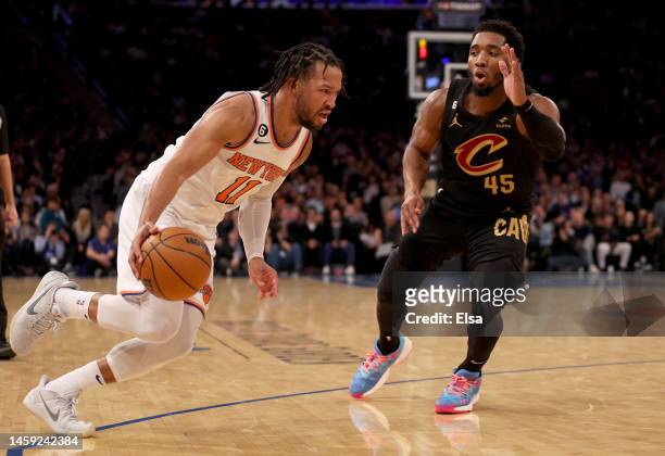 Jalen Brunson of the New York Knicks drives past Donovan Mitchell of the Cleveland Cavaliers in the third quarter at Madison Square Garden on January...