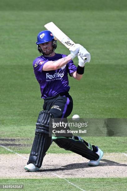 Mac Wright of the Hurricanes hits a boundary during the Men's Big Bash League match between the Hobart Hurricanes and the Brisbane Heat at University...