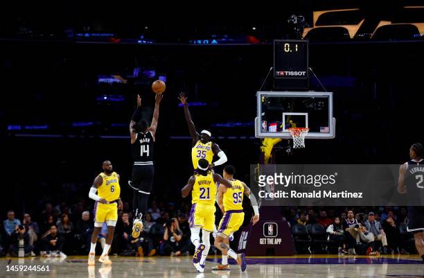 Terance Mann of the LA Clippers makes a three-point shot against the Los Angeles Lakers at the end of the first quarter at Crypto.com Arena on...