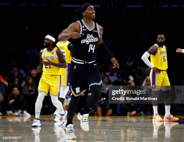 Terance Mann of the LA Clippers makes a three-point shot against the Los Angeles Lakers at the end of the first quarter at Crypto.com Arena on...