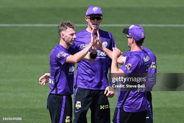 Riley Meredith of the Hurricanes celebrates the wicket of Usman Khawaja of the Heat during the Men's Big Bash League match between the Hobart...