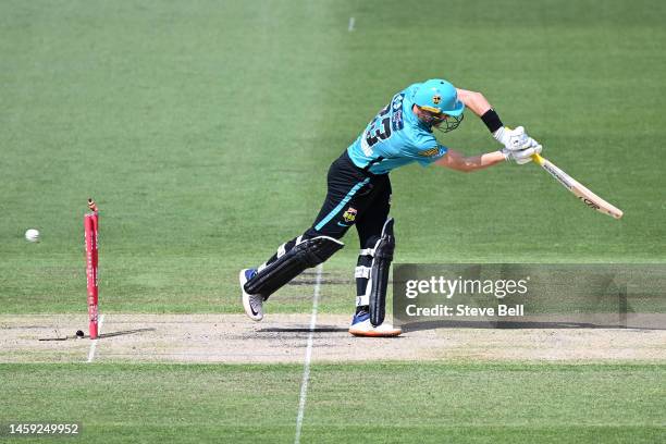 Marnus Labuschagne of the Heat is bowled by Nathan Ellis of the Hurricanes during the Men's Big Bash League match between the Hobart Hurricanes and...