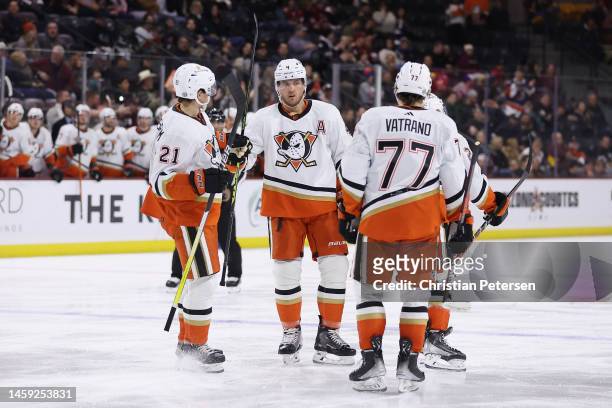 Isac Lundestrom, Cam Fowler and Jayson Megna of the Anaheim Ducks celebrate after Fowler scored a goal against the Arizona Coyotes during the third...