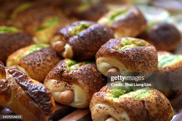 sausage rolls on a display - sausage roll stock pictures, royalty-free photos & images