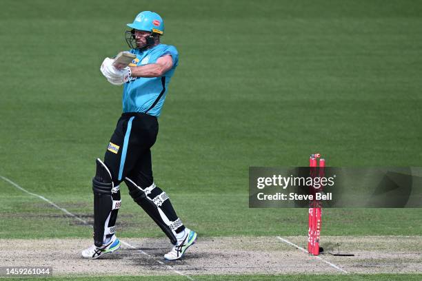 Michael Neser of the Heat is bowled by Joel Paris of the Hurricanes during the Men's Big Bash League match between the Hobart Hurricanes and the...