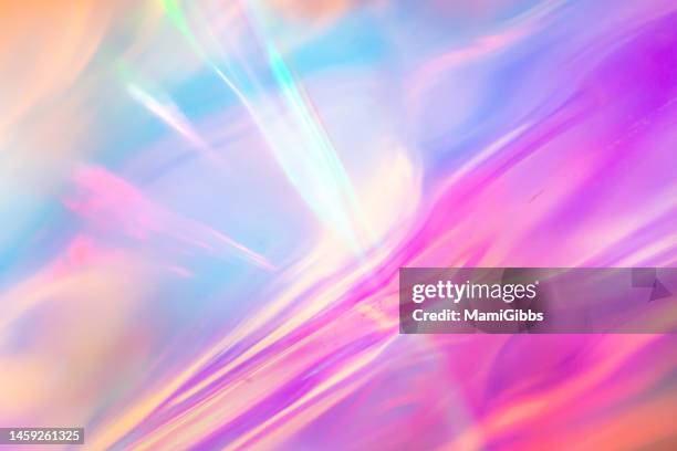 many colors are reflected on the holographic paper - holograma fotografías e imágenes de stock