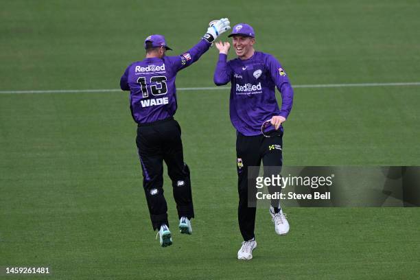 Zac Crawley and Matthew Wade of the Hurricanes celebrate during the Men's Big Bash League match between the Hobart Hurricanes and the Brisbane Heat...