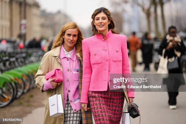 Blanca Miro wears a white shirt, a pale pink braided wool buttoned cardigan from Chanel, a beige long trench coat, a black and white checkered print...