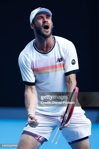 Tommy Paul of the United States celebrates winning match point in the Quarterfinal singles match against Ben Shelton of the United States during day...