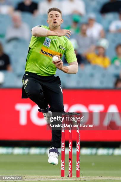 Daniel Sams of the Thunder bowls during the Men's Big Bash League match between the Melbourne Stars and the Sydney Thunder at Melbourne Cricket...