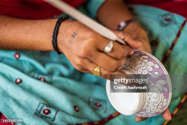 woman painting jaipur's blue pottery, rajasthan, india - earthenware stock pictures, royalty-free photos & images