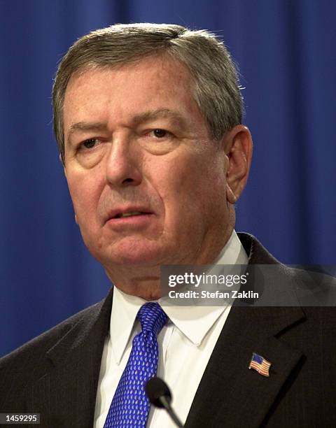 Attorney General John Ashcroft speaks at a media conference at the U.S. Department of Justice October 4, 2002 in Washington, DC. Ashcroft announced...