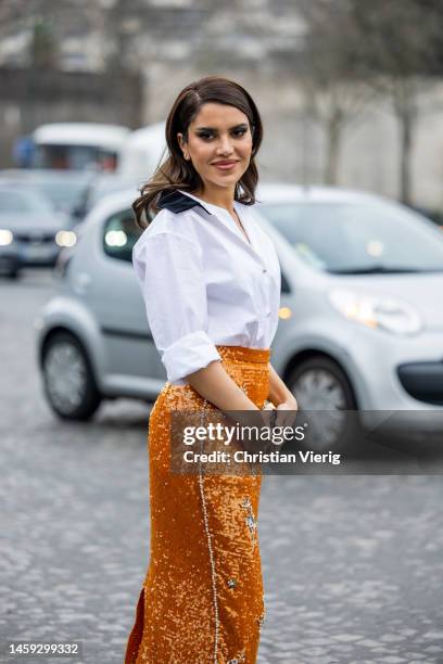 Guest wears high waisted skirt, white blouse outside Stéphane Rolland during Paris Fashion Week - Haute Couture Spring Summer : Day Two on January...