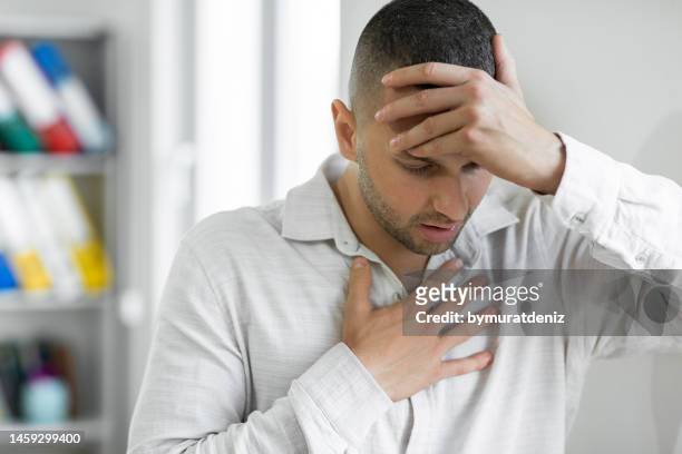 man suffering from breathing problem - breathing problems stock pictures, royalty-free photos & images