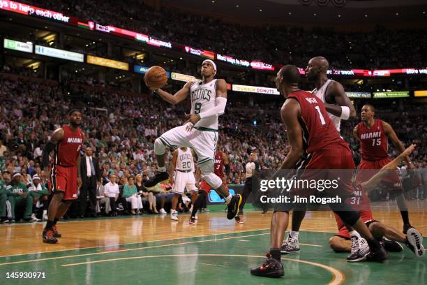 Rajon Rondo of the Boston Celtics drives for a shot attempt in the first half against the Miami Heat in Game Six of the Eastern Conference Finals in...