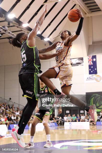 Tahjere McCall of the Taipans drives to the basket against Alan Williams of the Phoenix during the round 17 NBL match between South East Melbourne...