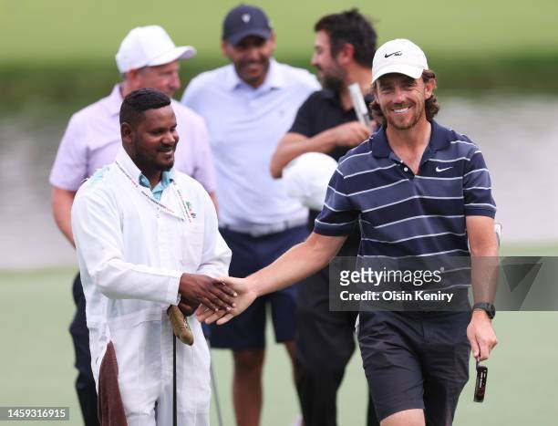 Tommy Fleetwood of England shakes hands with a playing partner's during the Pro-Am prior to the Hero Dubai Desert Classic at Emirates Golf Club on...