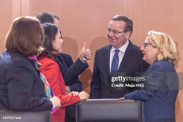 German Defense Minister Boris Pistorius is surrounded by Minister for Economic Cooperation and Development Svenja Schulze , Foreign Minister Annalena...