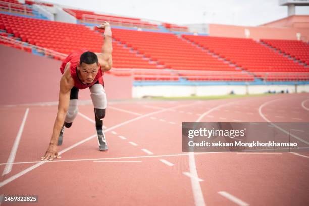 disabled man athlete training with leg prosthesis. - paraplegic race stock pictures, royalty-free photos & images