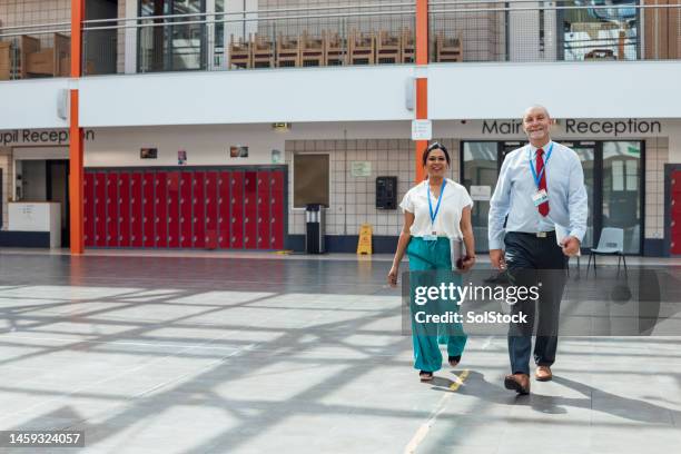 walking through the hall - inside locker stock pictures, royalty-free photos & images