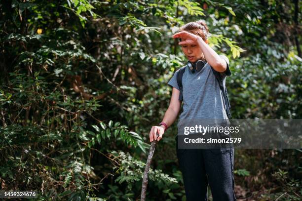 exhausted casual asian woman resting in the rainforest. - dyspnea stock pictures, royalty-free photos & images