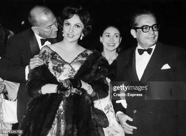 Noel Coward and Gina Lollobrigida with Margot Fonteyn and her husband, Roberto Arias at the opening of Coward's play 'Look After Lulu!'' at the New...