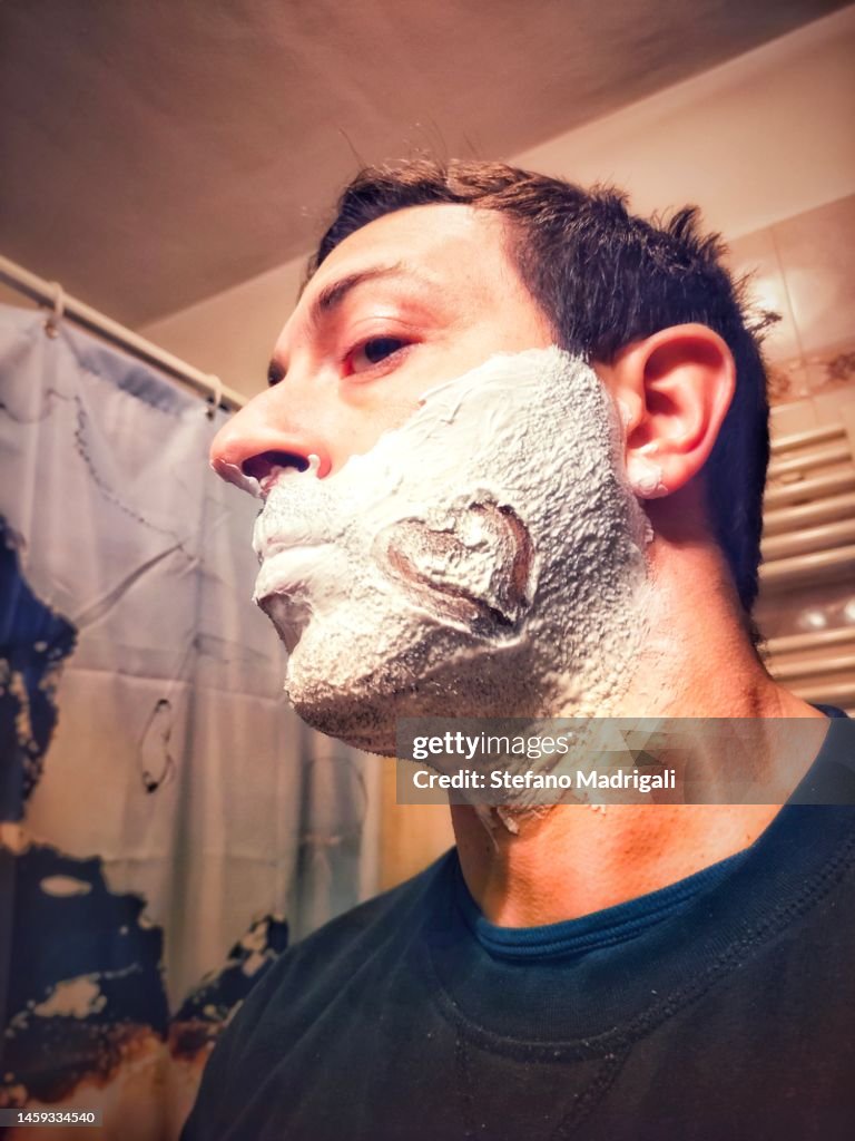 Drawn on the face covered by shaving foam, a heart