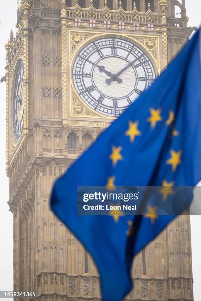 An EU flag is seen flying in front of Elizabeth Tower, commonly referred to as Big Ben, as protestors campaign against the ongoing impacts of Brexit...