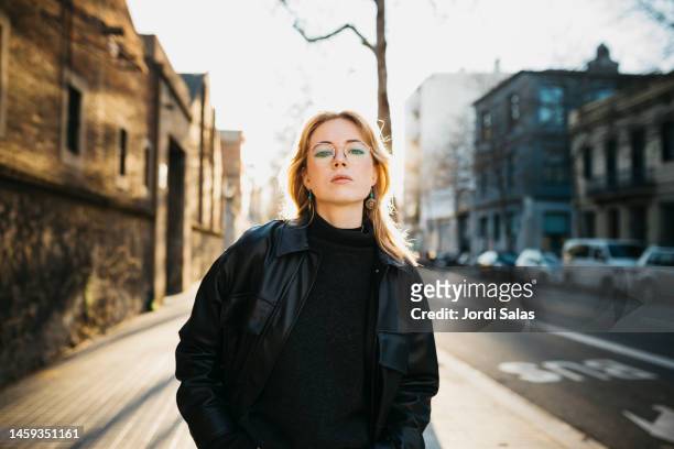 portrait of a young blonde woman on the street - women fashion model stock pictures, royalty-free photos & images