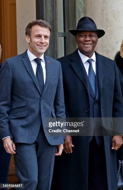 French President Emmanuel Macron poses with Ivory Coast President Alassane Ouattara prior to a working lunch at the Elysee Palace on January 25, 2023...