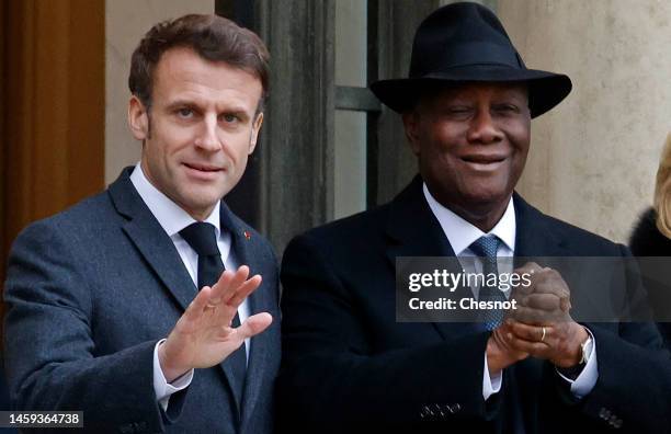 French President Emmanuel Macron poses with Ivory Coast President Alassane Ouattara prior to a working lunch at the Elysee Palace on January 25, 2023...