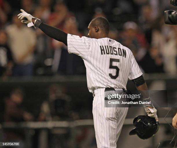 Orlando Hudson of the Chicago White Sox points to the crowd after getting the game-winning hit in the bottom of the 9th inning against the Toronto...