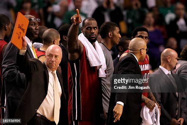 LeBron James of the Miami Heat points towards the Boston Celtics bench after the Heat won 98-74 in Game Six of the Eastern Conference Finals in the...