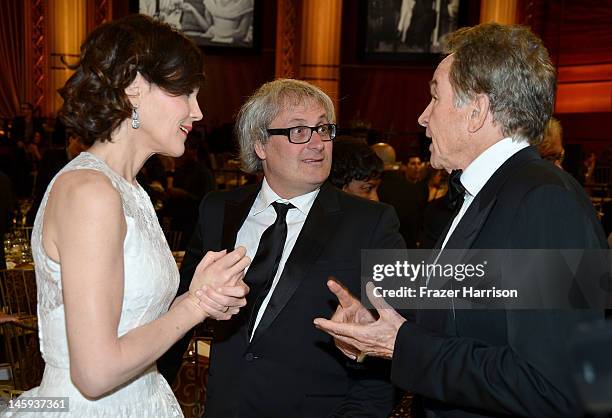 Actress Elizabeth McGovern, filmmaker Simon Curtis, and actor Warren Beatty attend the 40th AFI Life Achievement Award honoring Shirley MacLaine held...