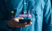 Online Donation on Mobile phone, Volunteer and Charity. Donate money for them in need, Making Donate via Internet Online donation concept.