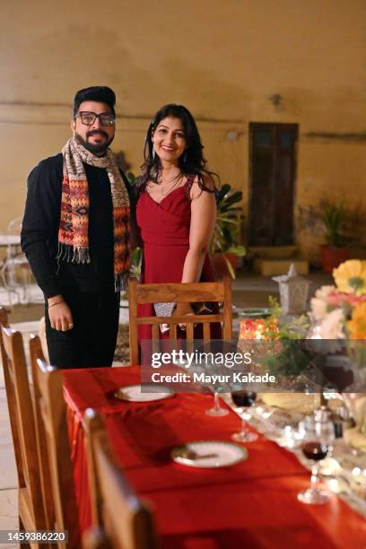 portrait of a beautiful couple at a dinner party - candlelight stock pictures, royalty-free photos & images