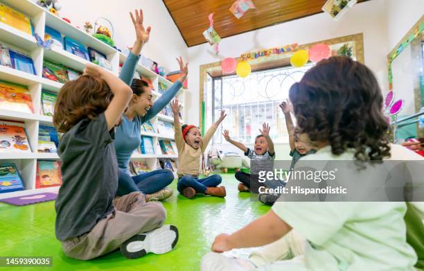 happy group of kids having fun at elementary school - preschool age stockfoto's en -beelden
