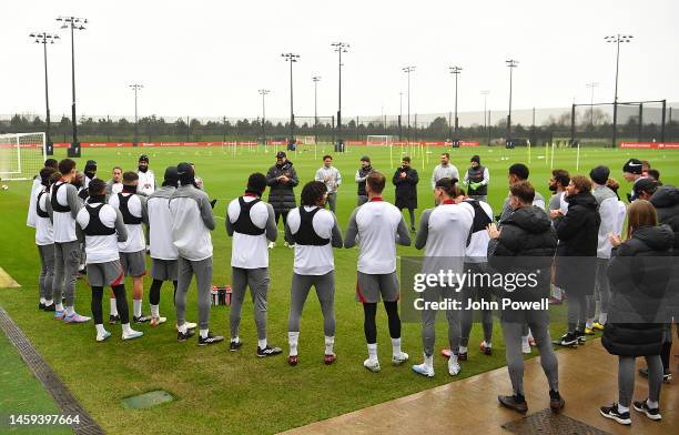 The Liverpool Team sing happy birthday to Pepijn Lijnders of Liverpool during a training session at AXA Training Centre on January 25, 2023 in...