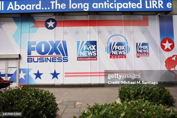 The logos for Fox programs are displayed on the News Corp. Building on January 25, 2023 in New York City. Chairman and CEO of News Corporation Rupert...