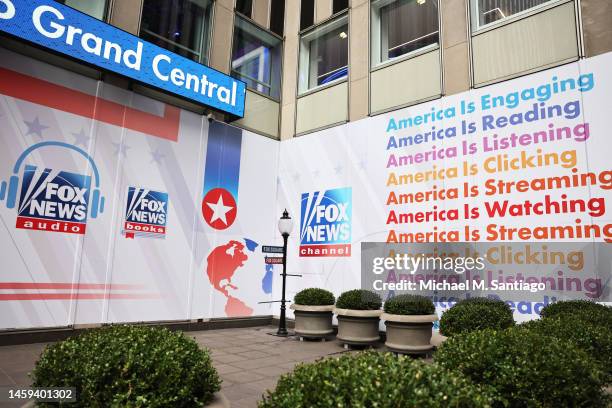 The logos for Fox programs are displayed on the News Corp. Building on January 25, 2023 in New York City. Chairman and CEO of News Corporation Rupert...