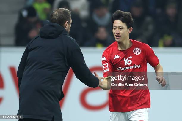 Lee Jae-Song of 1.FSV Mainz 05 celebrates with Bo Svensson, Head Coach of 1.FSV Mainz 05, after scoring their sides first goal during the Bundesliga...