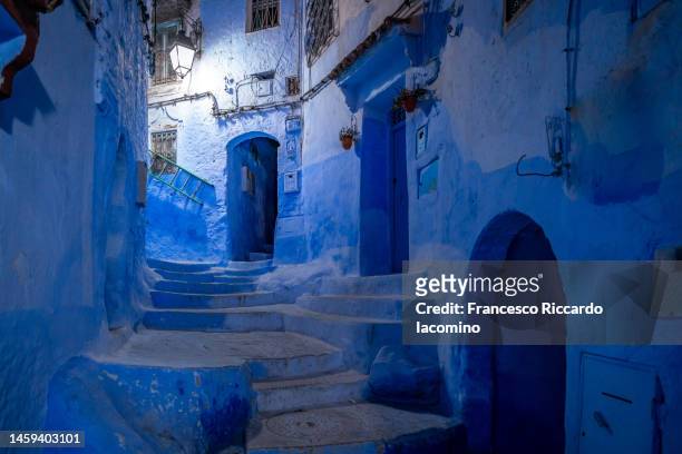 the blue city of chefchaouen at night, morocco. - chefchaouen medina stock pictures, royalty-free photos & images