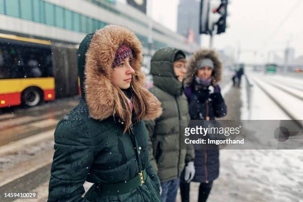winter in the city - people walking in city of warsaw in on winter day - daily life in warsaw stock pictures, royalty-free photos & images