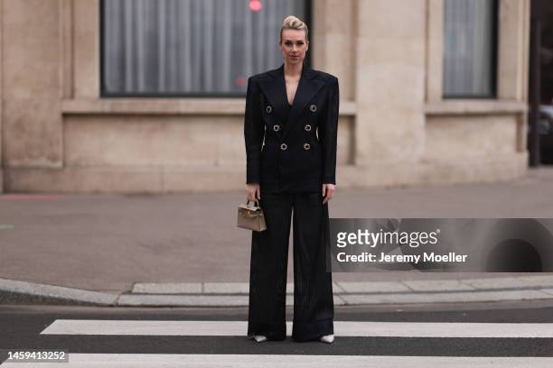 Marina von Lison seen wearing Hermes mini Kelly beige leather bag, Alexandre Vauthier sparkling transparent heels and Nicolas Besson matching suit...