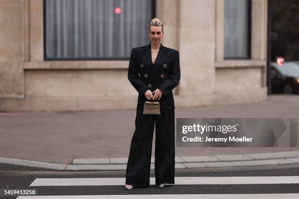 Marina von Lison seen wearing Hermes mini Kelly beige leather bag, Alexandre Vauthier sparkling transparent heels and Nicolas Besson matching suit...