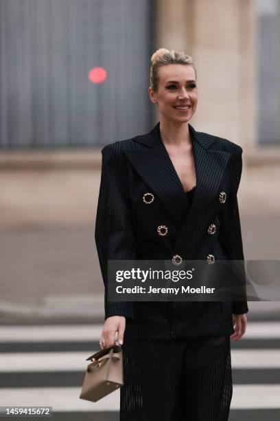 Marina von Lison seen wearing Hermes mini Kelly beige leather bag and Nicolas Besson matching suit before Alexandre Vauthier show during Paris...